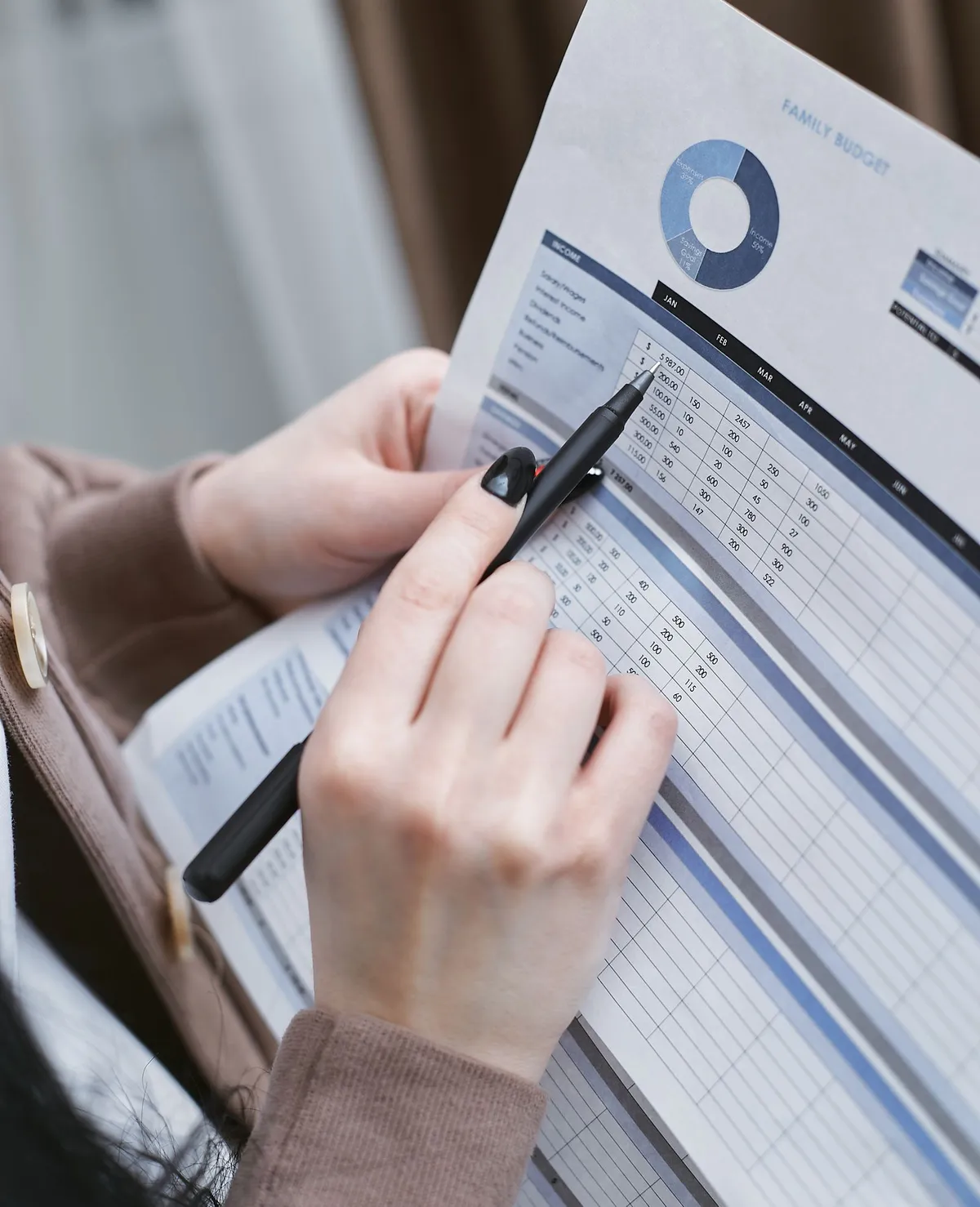 Person reviewing a household budget while rebuilding finances after bankruptcy